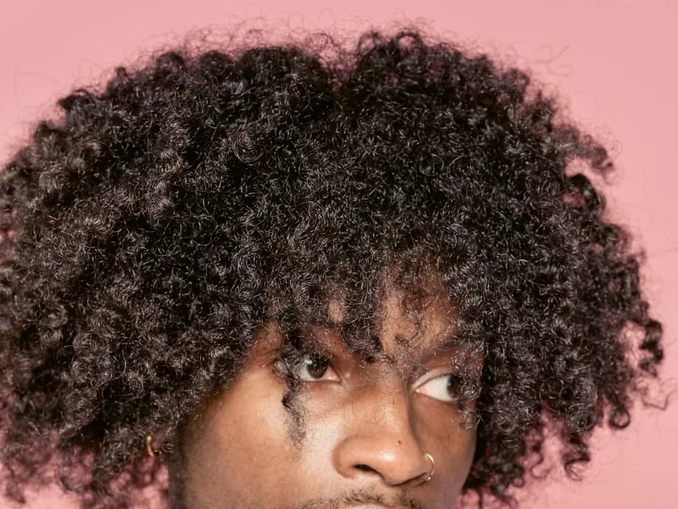 Man with defined medium curls